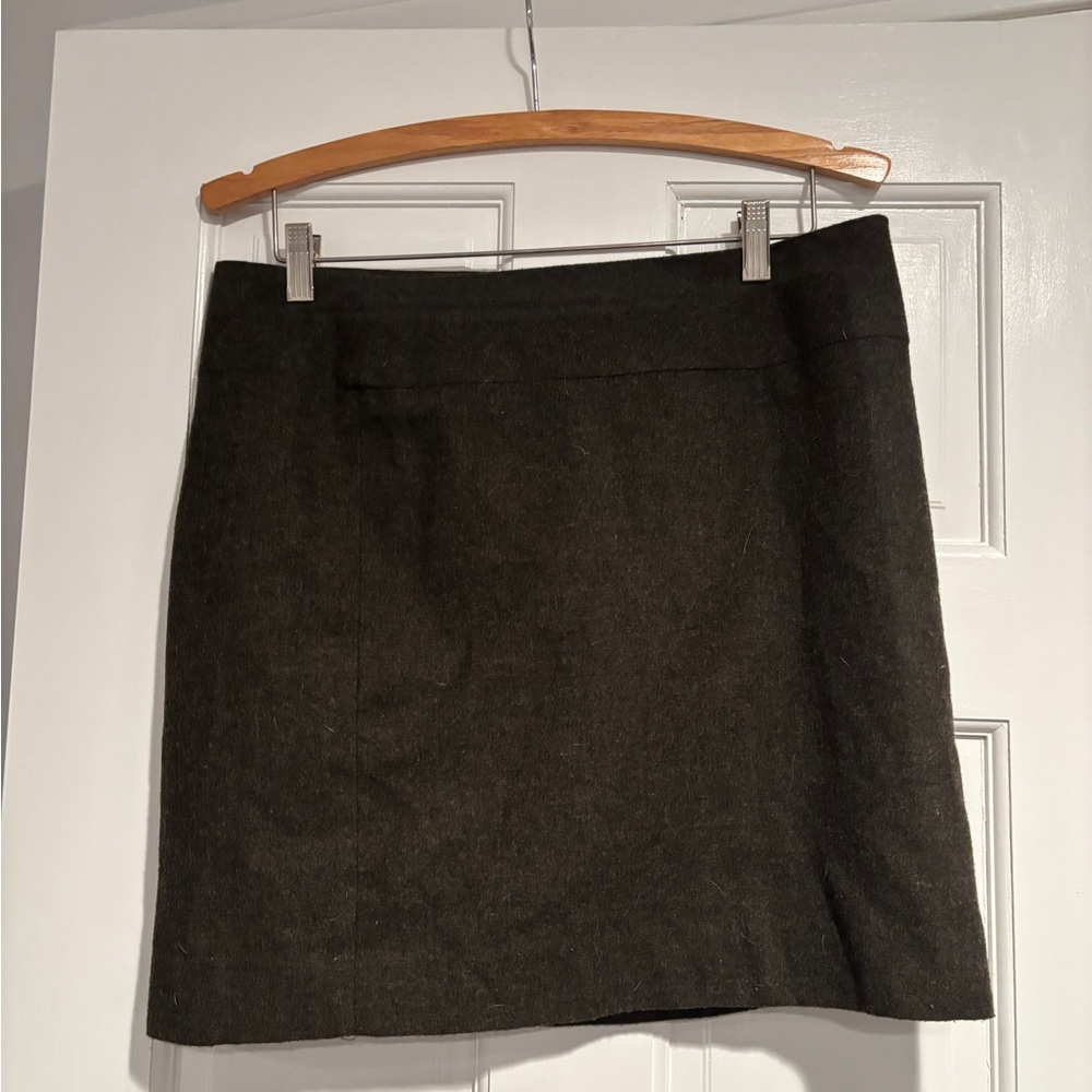 Dark green lined mini wool skirt 
Very comfortable with side zipper